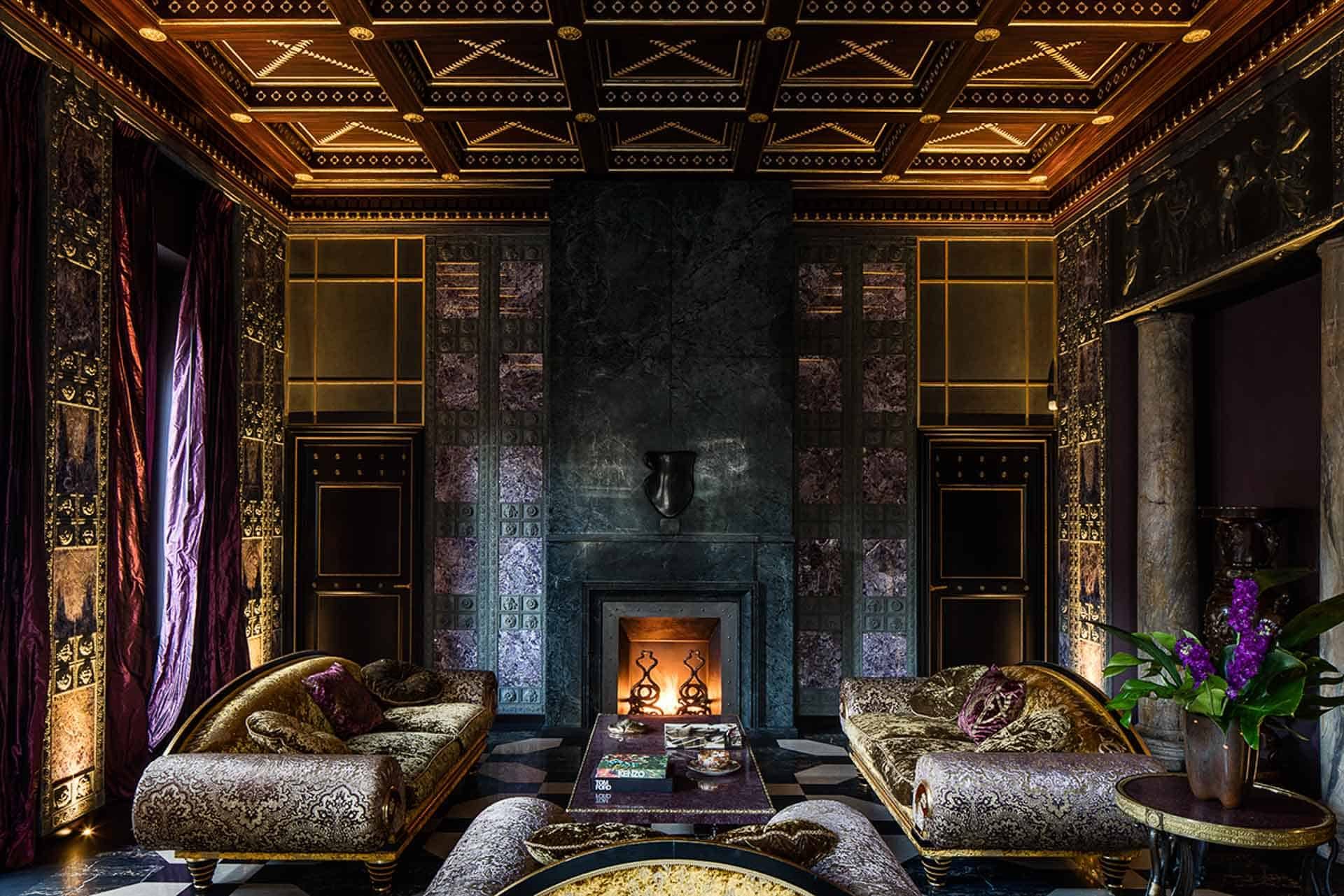 Villa Clara — a salon with a coffered ceiling, fireplace and gilded sofas · Rome, Italy